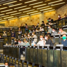 Lecture hall with pupils and students