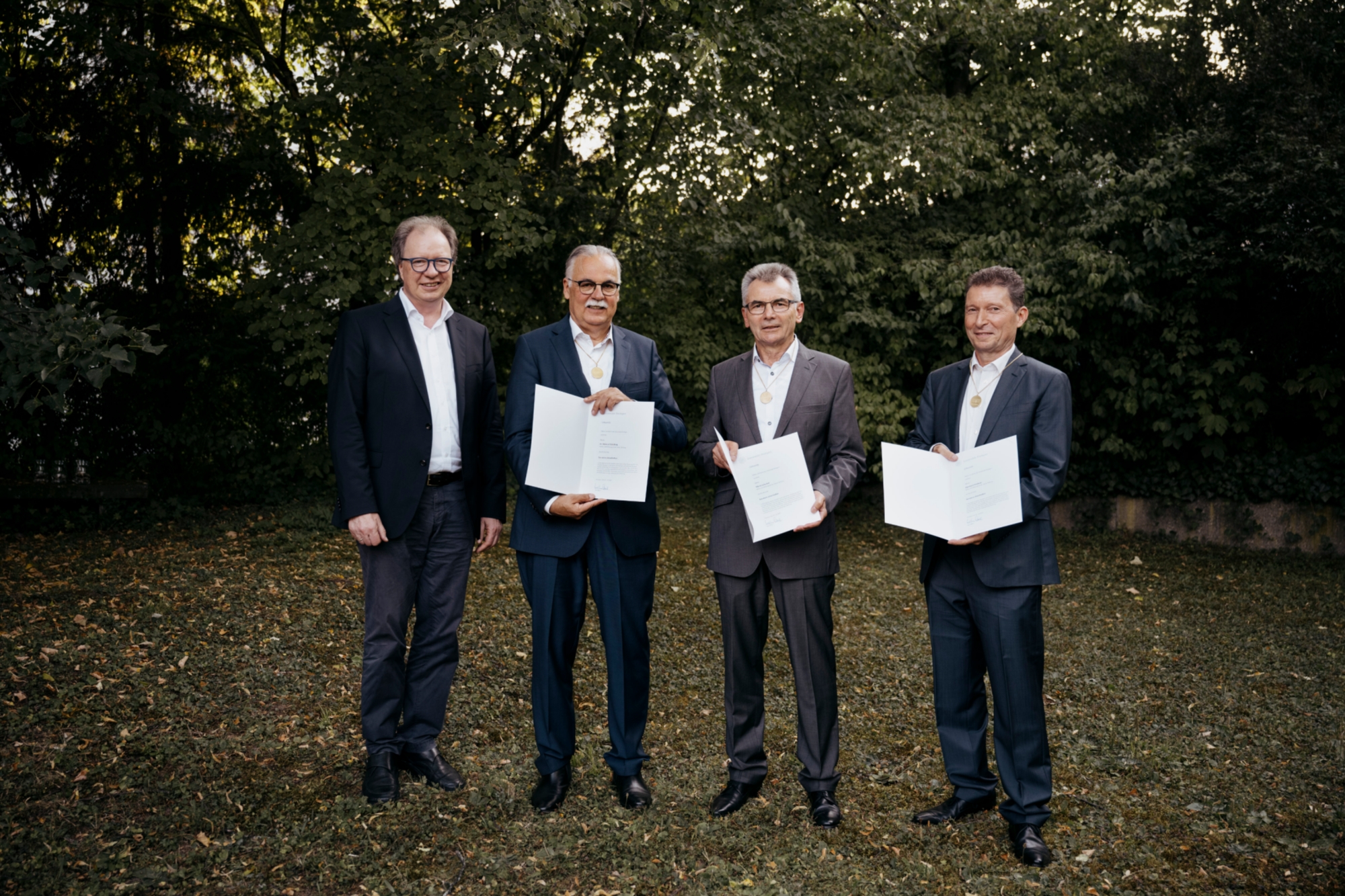 Rektor Prof. Wolfram Ressel, Dr. Helmut Schelling, Martin Litschel und Eberhard Hinderer (von links)