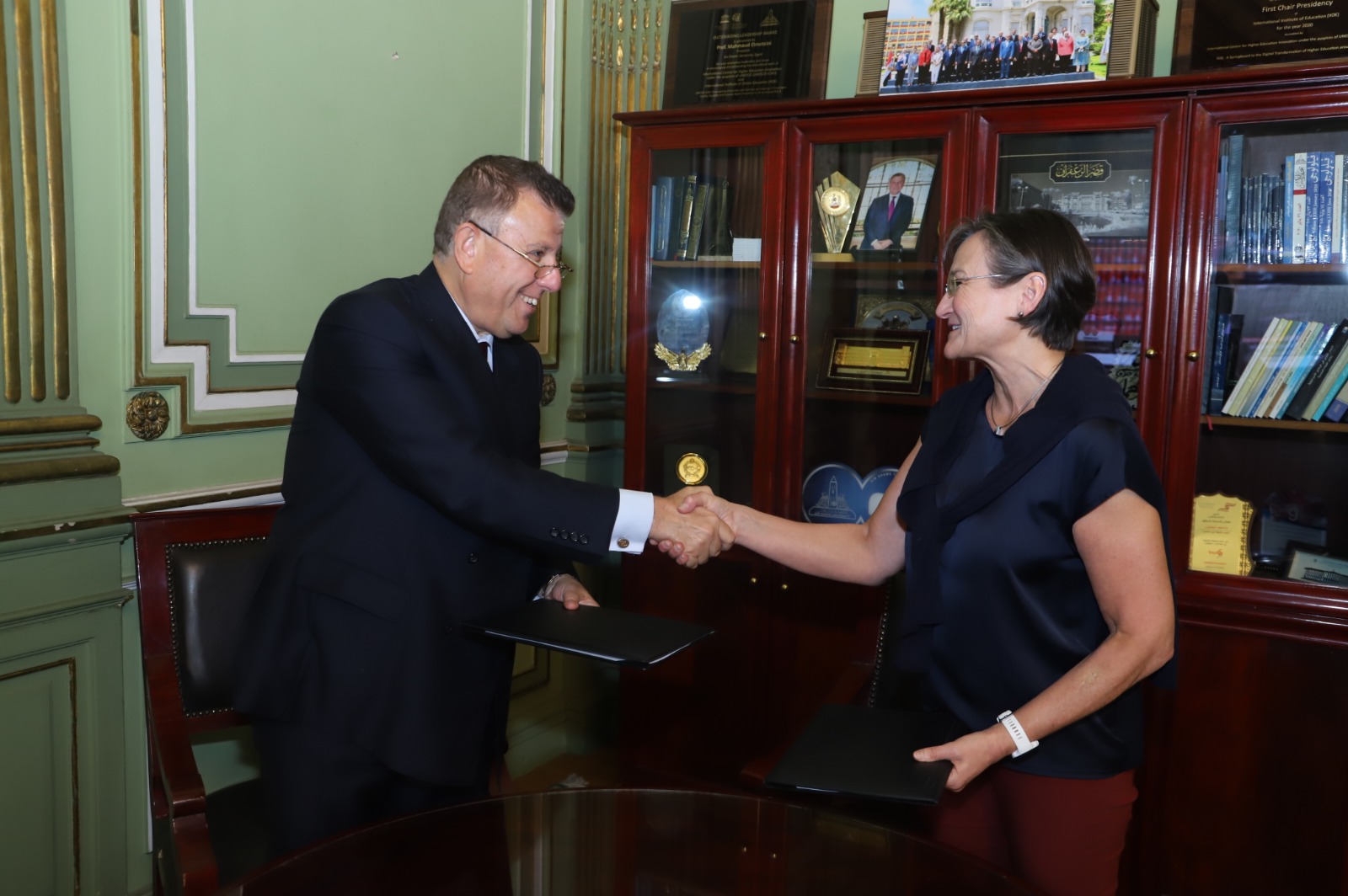 Prof. Wieprecht shakes hands after the memorandum of understanding is signed by ASU