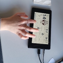 Hand operating the tactile user interface