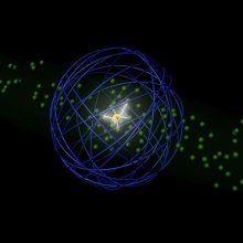Der geladene Kern eines Riesenatoms wechselwirkt mit benachbarten Atomen, während das Elektron weit entfernt den Kern vor elektrischen Störfeldern schützt.