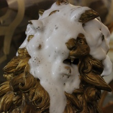 Head of a lion sculpture during cleaning with foam