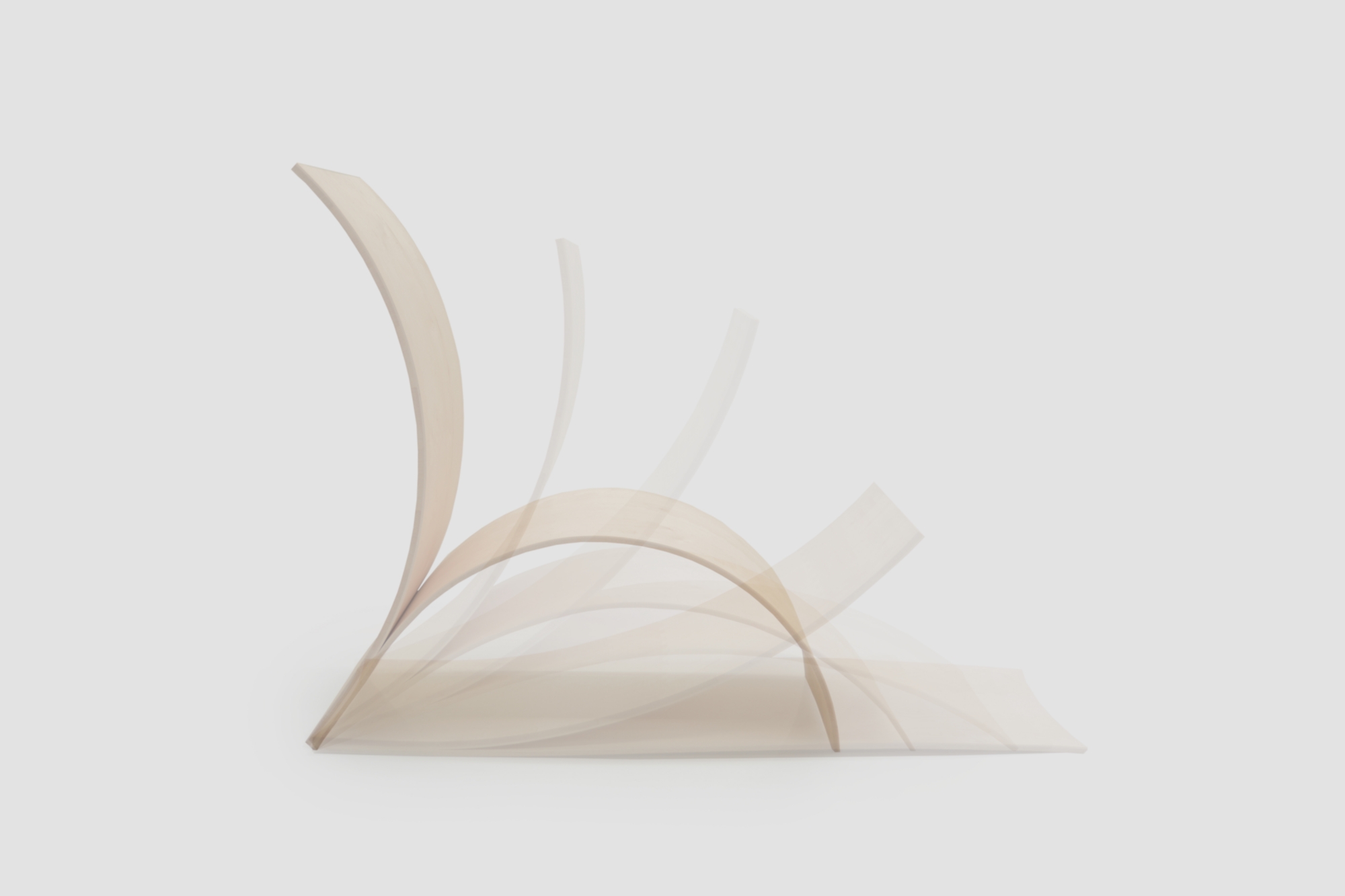 The stages of the self-shaping process: By air-drying, the flat, compact shape is transformed into the stable, curved geometry of a chair.