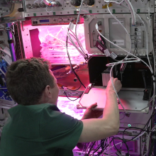 A NASA astronaut installs FARGO on the ISS.