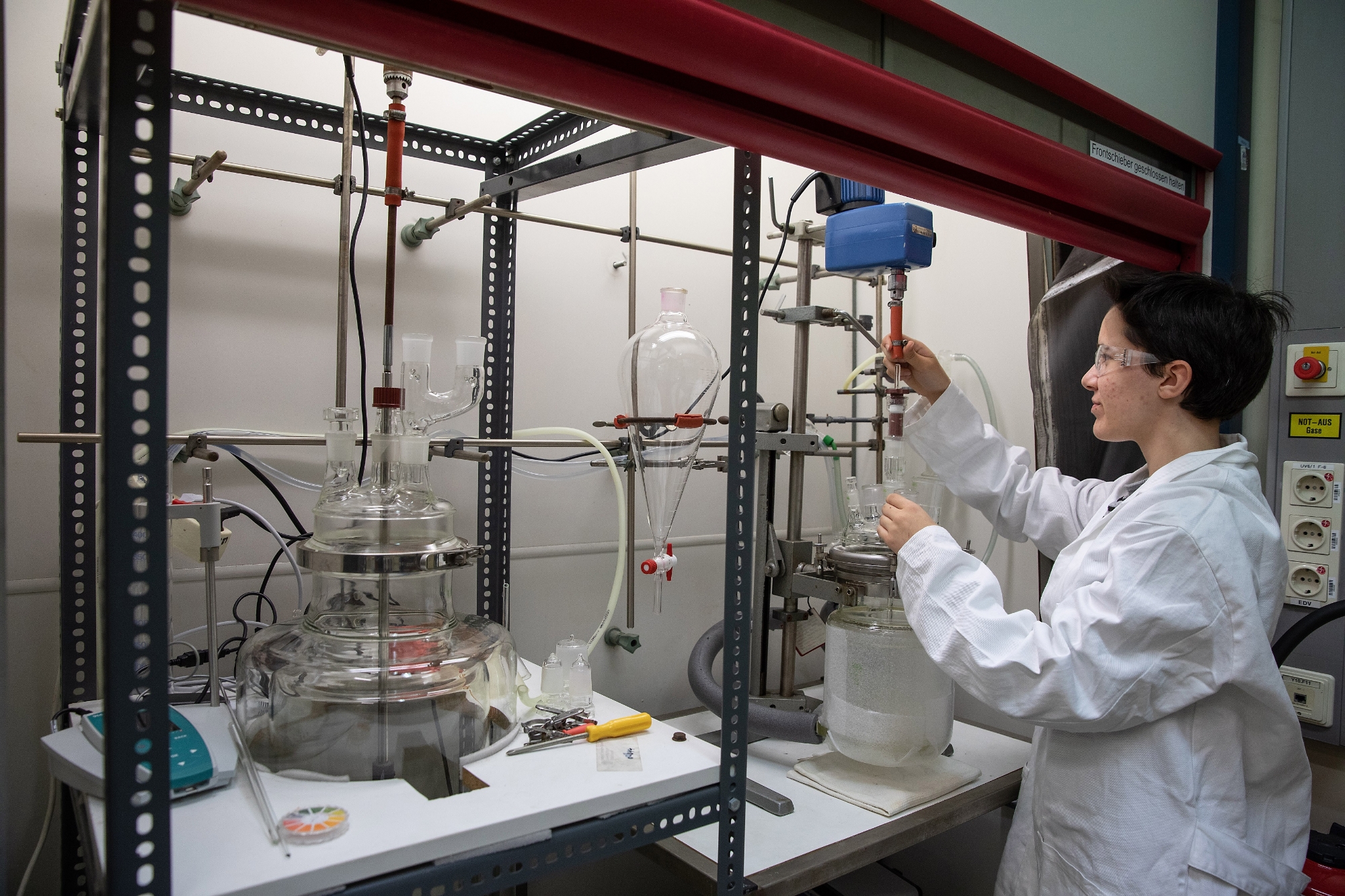 Scientist stands in a chemistry laboratory