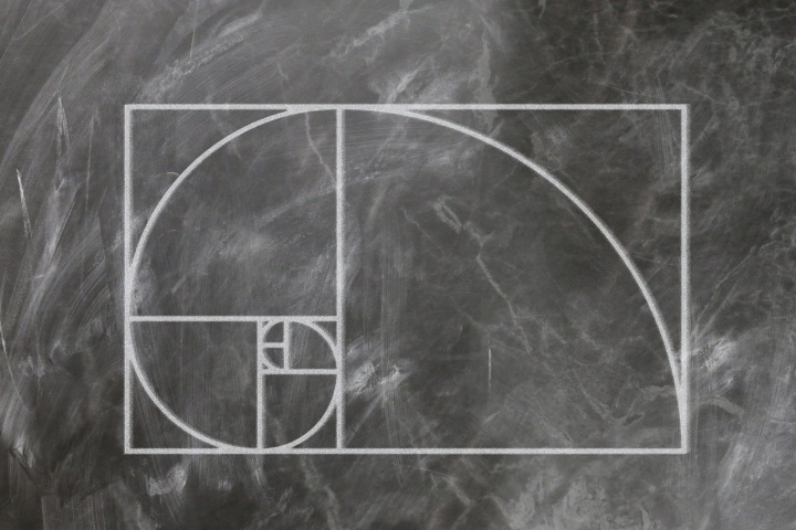 Fibonacci spiral, drawn with chalk on a blackboard