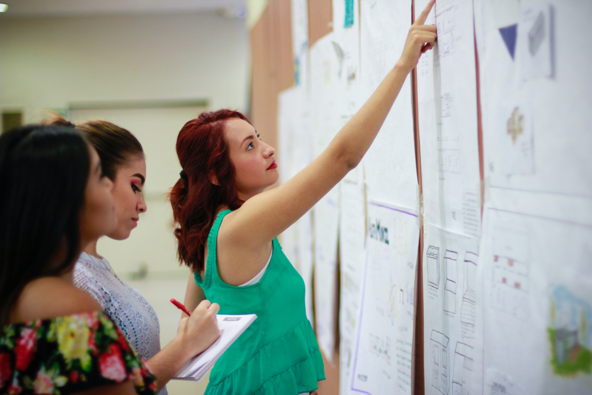 Women work together on a board