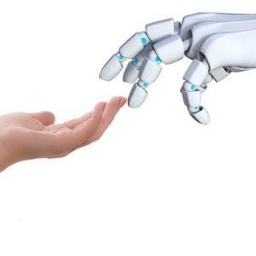 Menschliche Hand trifft auf Roboterhand