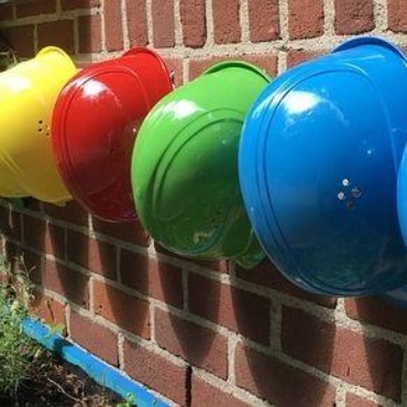 construction helmets on an exterior wall